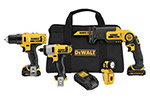 A set of Dewalt cordless power tools including a drill, impact driver, reciprocating saw, flashlight, battery, and carrying bag.