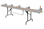 A metal scaffolding plank with adjustable supports and multiple handles for easy carrying.