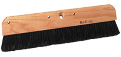 A broom with a wooden handle and long black bristles, designed for sweeping floors.