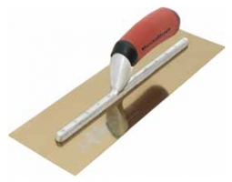 A trowel with a red handle resting on a metallic surface.