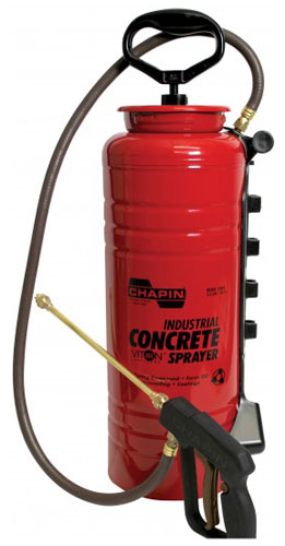 Red industrial concrete sprayer with a pump handle, hose, and spray nozzle.