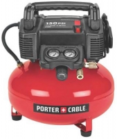A red air compressor with a black motor and handle, featuring pressure gauges and a hose attachment, branded Porter-Cable.