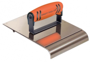 Stainless steel trowel with an orange rubber grip handle, used for smoothing and applying materials.