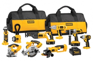 A collection of Dewalt power tools and accessories displayed with two tool bags, including a circular saw, impact driver, drill, and flashlight.