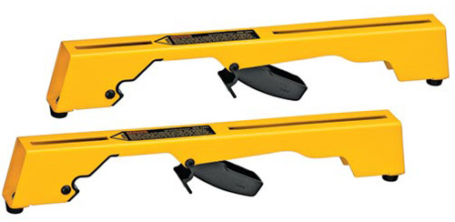 Two yellow loading ramps designed for vehicles, featuring a release lever and a slotted surface for traction.