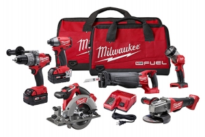 A collection of Milwaukee M18 Fuel power tools displayed with a red carrying bag, including a drill, impact driver, reciprocating saw, circular saw, angle grinder, flashlight, and battery charger.