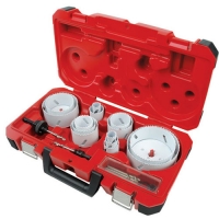 A red tool case opened to display various hole saws and drill bits organized inside.