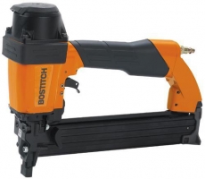 A Bostitch pneumatic nail gun featuring a black and orange design, designed for fastening materials in construction and woodworking.