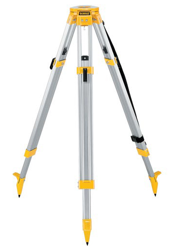 A yellow and silver tripod surveying instrument with adjustable legs and pointed feet for stability.