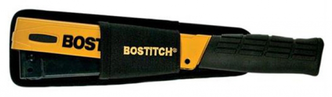 A BOSTITCH stapler with a yellow and black design, shown inside a protective sleeve.