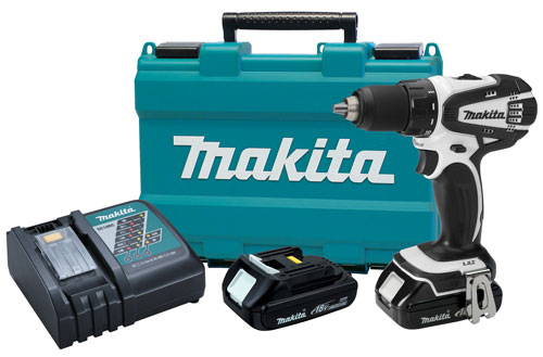 A Makita power drill kit including a cordless drill, battery charger, and two rechargeable batteries, all displayed next to a blue Makita carrying case.
