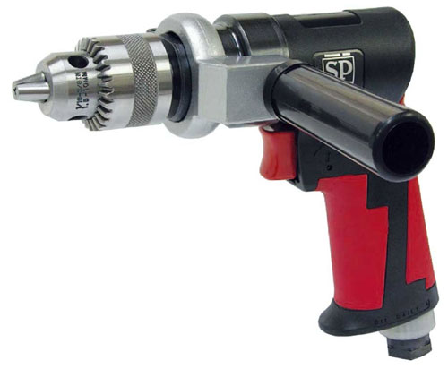 Close-up of a pneumatic drill with a textured black handle and red accents, featuring a metal chuck for drill bits.