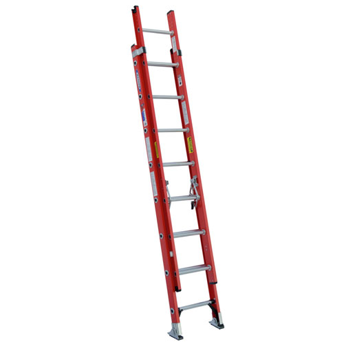 A red aluminum extension ladder with multiple rungs and safety features.