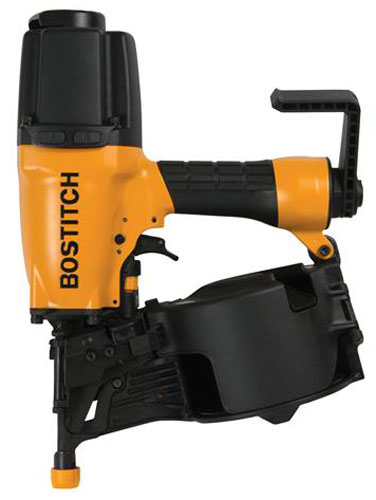 A Bostitch nail gun with a black and orange design, featuring a magazine for nails, a handle for grip, and a safety mechanism.