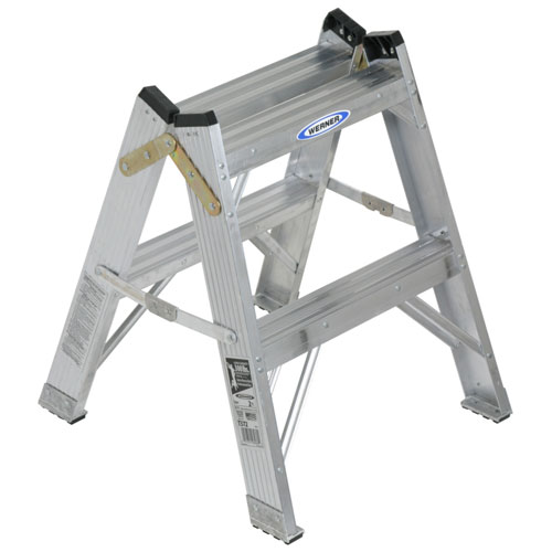 A sturdy aluminum Step Ladder with a two-step design, featuring a Werner logo and safety instructions.